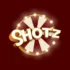 Shotz Casino logo med gylden tekst og roulettehjul på en dyp rød bakgrunn.
